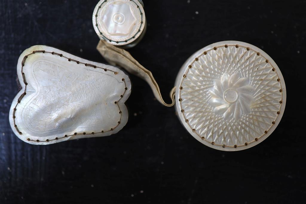 Eight assorted 19th century mother of pearl mounted pin cushions